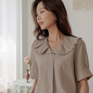 Women’s pintuck collar blouse by Justone.
